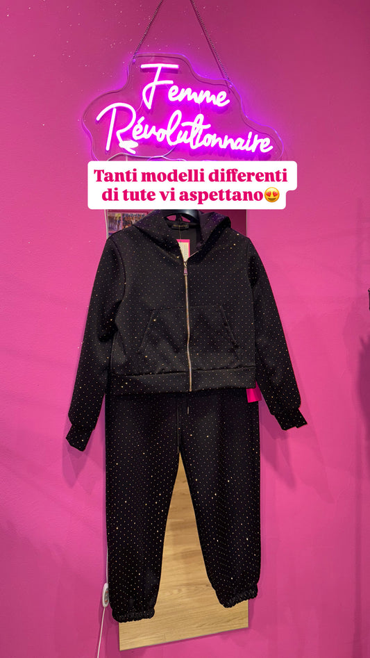 Tuta con zip brillantinata nera